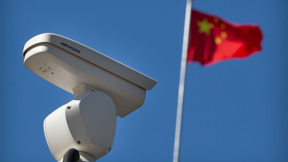 A Chinese flag flies near a security camera monitoring a traffic intersection in Beijing, Tuesday, October 8, 2019.  - Mark Schiefelbein/AP