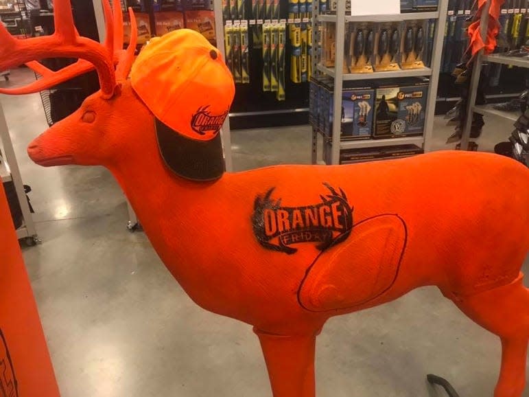 FILE - Fleet Farm’s 'Orange Friday' deer decoy.