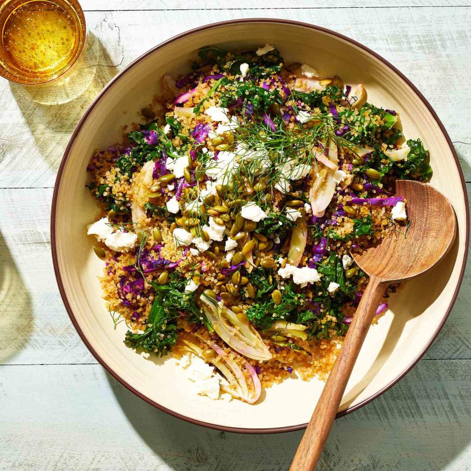 <p>Crisping the quinoa in the oven adds delicious texture to this bright and filling kale salad. The lemon-honey-garlic dressing complements the sweetness from the roasted vegetables. Topping the salad with feta and pepitas gives it a savory note. <a href="https://www.eatingwell.com/recipe/8028699/baked-kale-salad-with-crispy-quinoa/" rel="nofollow noopener" target="_blank" data-ylk="slk:View Recipe;elm:context_link;itc:0" class="link ">View Recipe</a></p>