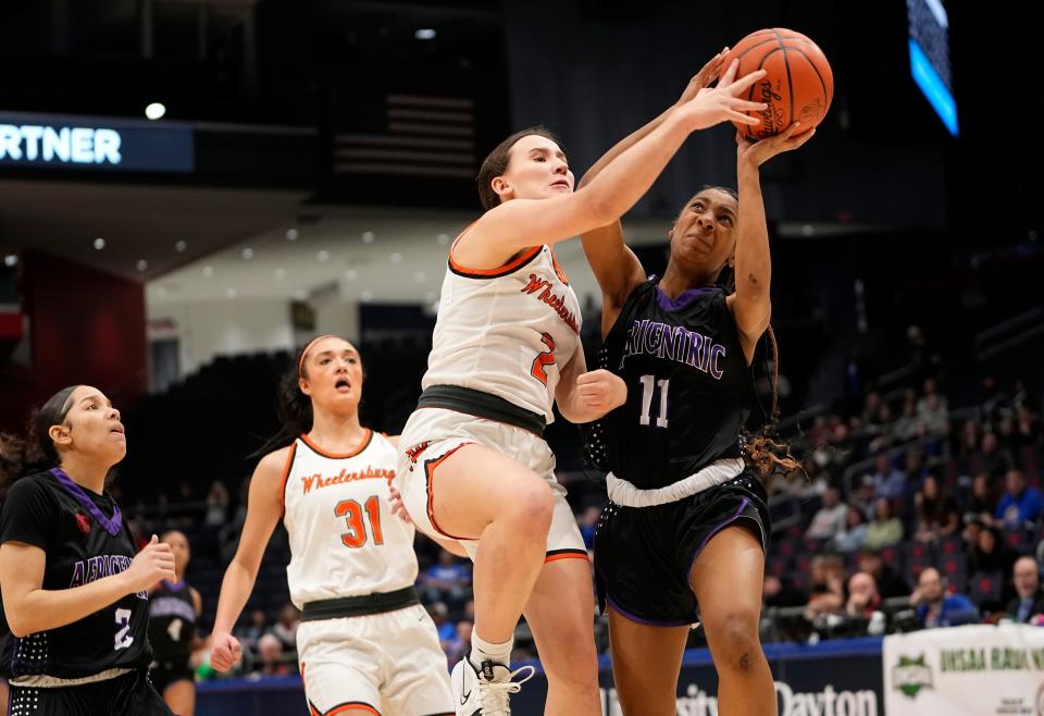 Africentric's Shaunie Little (11) is fouled by Wheelersburg's Mia Vastine during a Division III state semifinal last year.