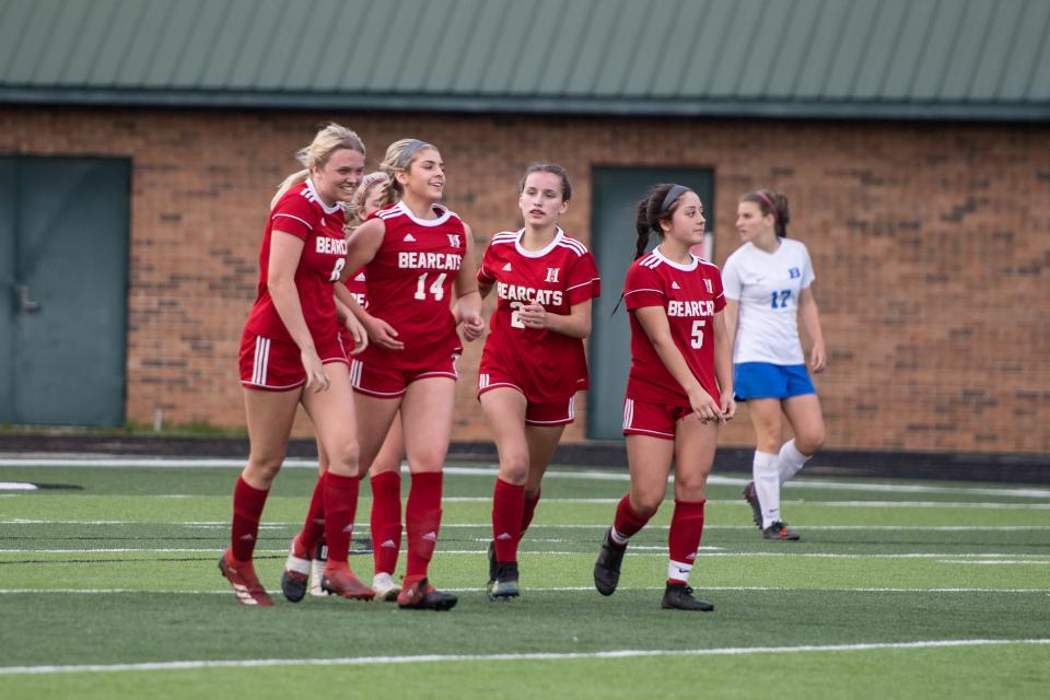 The Hendersonville girls soccer team celebrates a goal Monday night during its 6-2 win over Brevard. The Bearcats have now won 54 consecutive conference games and clinched a sixth consecutive conference title.