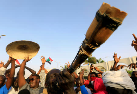 Sudanese demonstrators play traditional instruments during the sit-in protest outside Defence Ministry in Khartoum, Sudan April 20, 2019. REUTERS/Mohamed Nureldin Abdallah