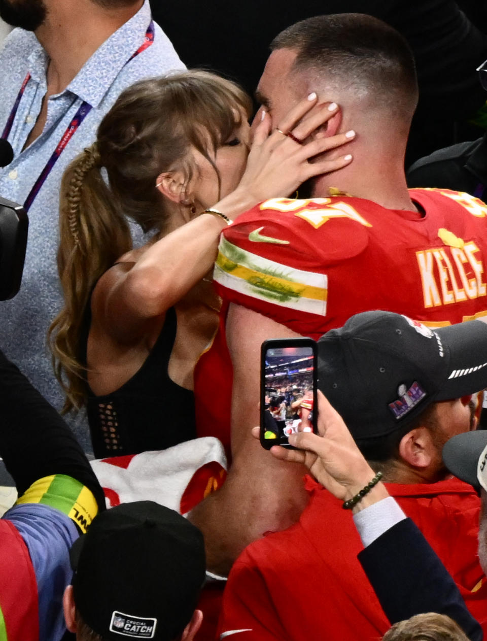US singer-songwriter Taylor Swift kisses Kansas City Chiefs' tight end #87 Travis Kelce after the Chiefs won Super Bowl LVIII against the San Francisco 49ers at Allegiant Stadium in Las Vegas, Nevada, February 11, 2024. (Photo by Patrick T. Fallon / AFP) (Photo by PATRICK T. FALLON/AFP via Getty Images)
