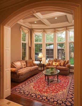 A view of a coffered wall in an elegant living room.