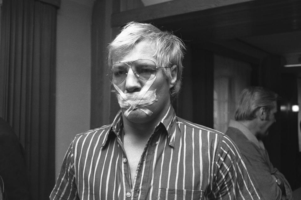 German boxer Wilhelm von Homburg, gets redressed after noon weighing on June 20, 1969 in Berlin, Germany. Homburg taped his mouth shut so he would not say something bad. (AP Photo/Edwin Reichert)