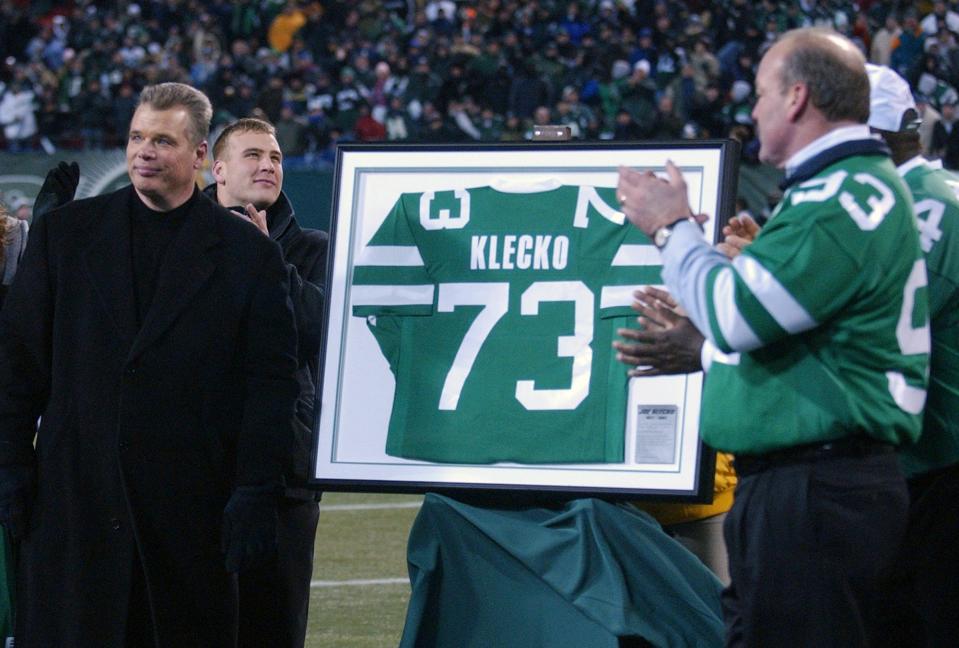 Former New York Jets defensive lineman Joe Klecko, left, had his jersey retired, Sunday, Dec. 26, 2004, at Giants Stadium in East Rutherford, N.J.