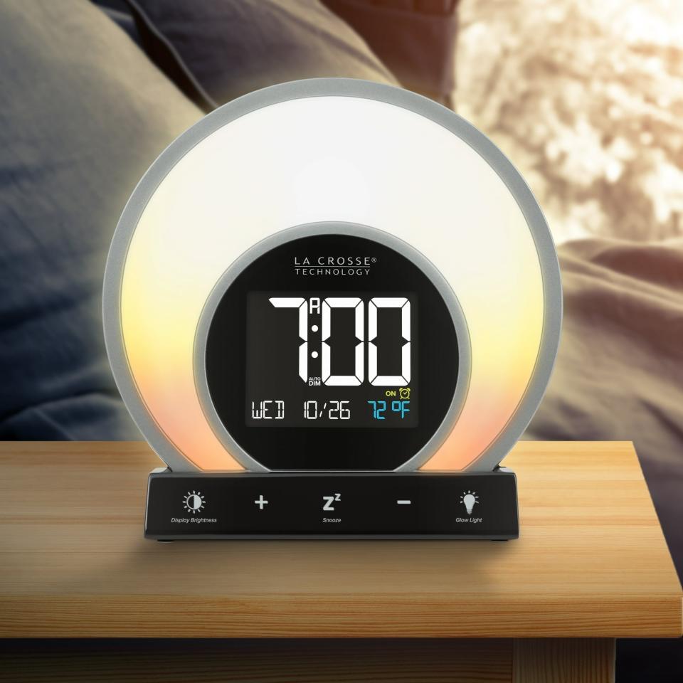 the alarm clock on a bedside table