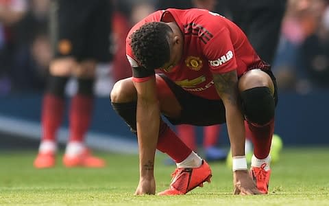 Manchester United's English striker Marcus Rashford takes a breather during a break in play during the English Premier League football match between Manchester United and Liverpool at Old Trafford in Manchester - Credit: getty images