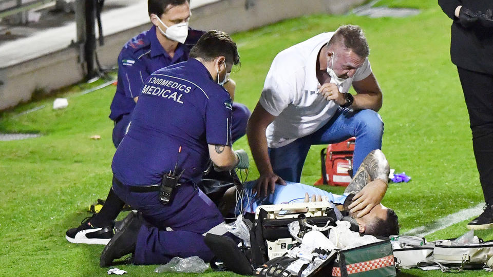 Pictured here, Andrew Fifita receives treatment on the side of the field after the NRL match.