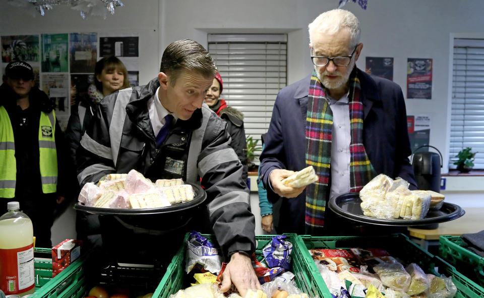 EMBARGOED TO 2230 WEDNESDAY DECEMBER 4 Labour Party leader Jeremy Corbyn helps to sort crates of food during a visit to Surviving the Streets in St. Leonards, East Sussex.