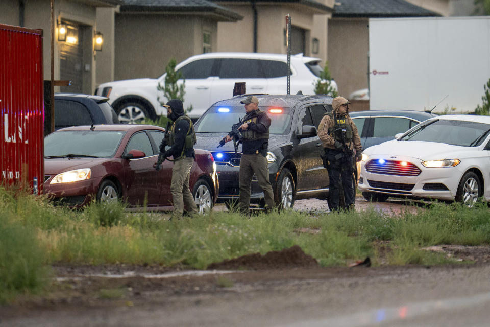 FILE - FBI agents raid the home of Samuel Bateman in Colorado City, Ariz., on on Sept. 13, 2022. Prosecutors have widened their case against the leader of a small polygamous group that resides near the Utah-Arizona border, adding child pornography charges and detailing his sexual encounters with children he took as wives in new charges filed earlier in May 2023. (Trent Nelson/The Salt Lake Tribune via AP, File)