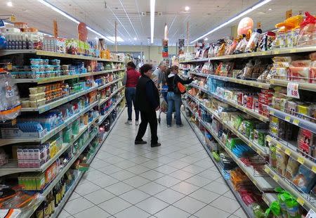 People are seen in a Conad grocery shop in Rome, Italy, April 10, 2016. REUTERS/Max Rossi