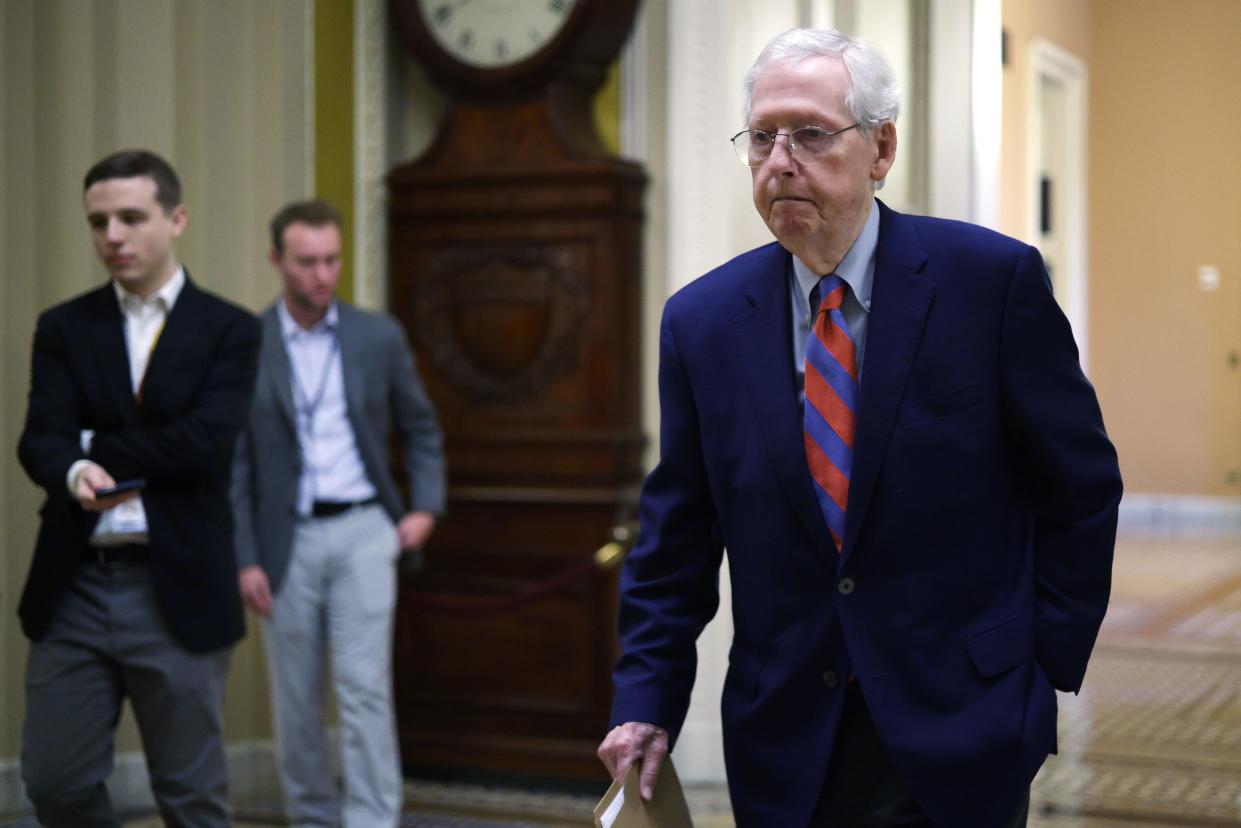 Senate Minority Leader Sen. Mitch McConnell, R-Ky., passes through a hallway at the U.S. Capitol on Dec. 4, 2023 in Washington, D.C.