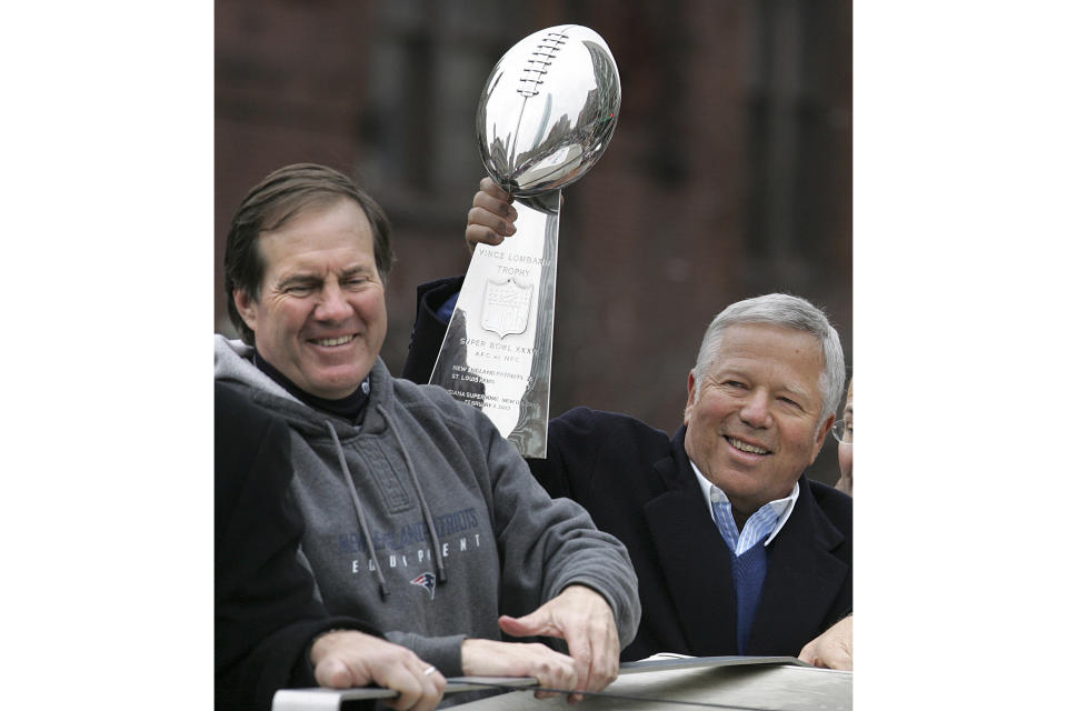 FILE - New England Patriots head coach Bill Belichick, left, smiles as team owner Robert Kraft holds up the Vince Lombardi trophy during a Super Bowl victory parade in Boston, Tuesday, Feb . 8, 2005. The Patriots beat the Philadelphia Eagles 24-21 in Super Bowl XXXIX. Six-time NFL champion Bill Belichick has agreed to part ways as the coach of the New England Patriots on Thursday, Jan. 11, 2024, bringing an end to his 24-year tenure as the architect of the most decorated dynasty of the league’s Super Bowl era, a source told the Associated Press on the condition of anonymity because it has not yet been announced. (AP Photo/Michael Dwyer, File)