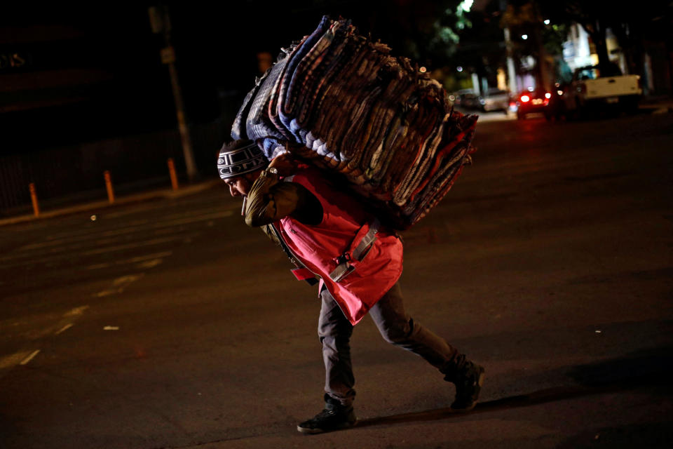 A volunteer carrying blankets after an earthquake hit Mexico City on September 8.