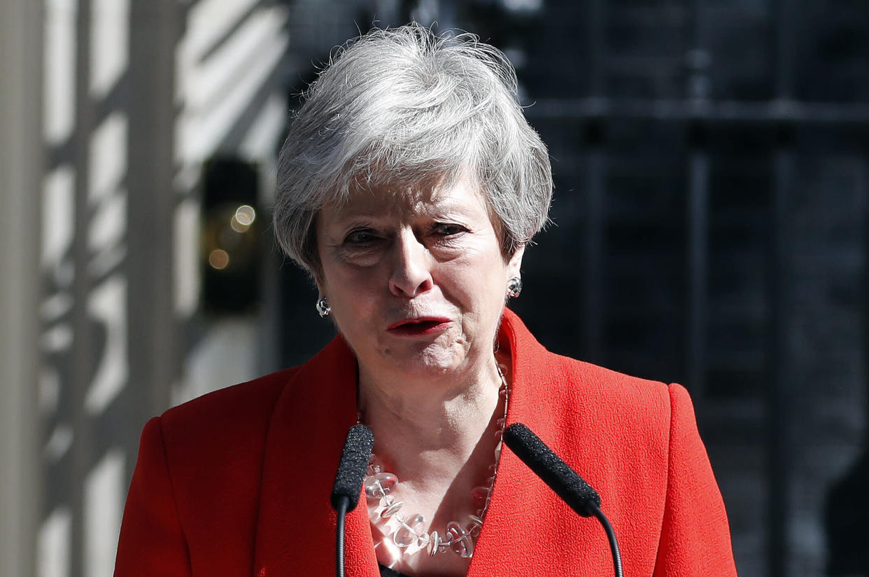 British Prime Minister Theresa May reacts as she makes a speech in the street outside 10 Downing Street in London, England, Friday, May 24, 2019. Theresa May says she'll quit as UK Conservative leader on June 7, sparking contest for Britain's next prime minister. (AP Photo/Alastair Grant)