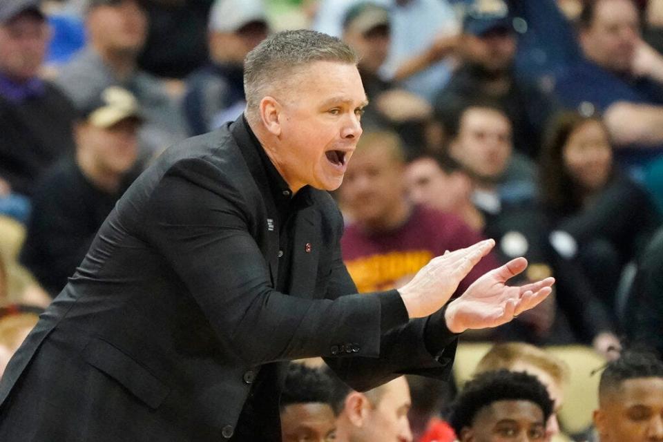 Ohio State head coach Chris Holtmann cheers on his team as they play against Loyola Chicago during the first half of a college basketball game in the first round of the NCAA tournament, Friday, March 18, 2022, in Pittsburgh. (AP Photo/Keith Srakocic)