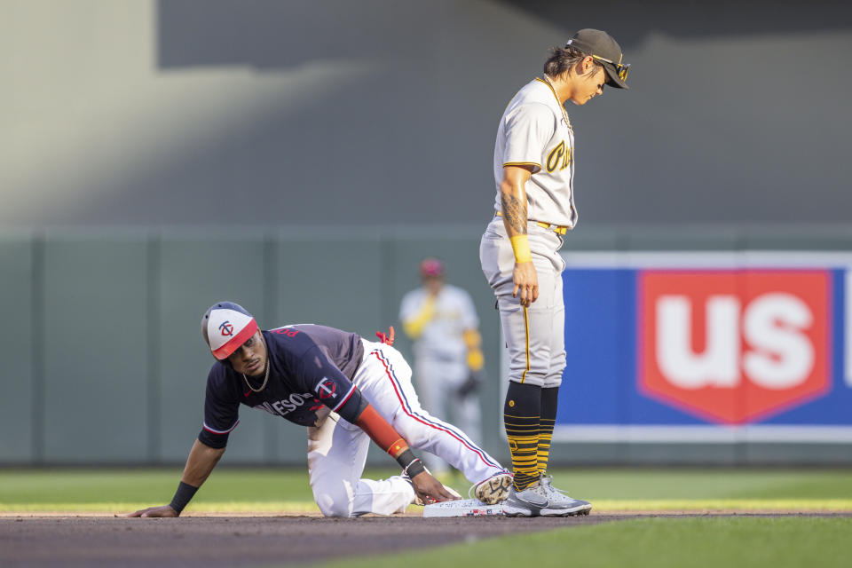 Minnesota Twins' Jorge Polanco steals second base next to Pittsburgh Pirates second baseman Ji Hwan Bae covers the bag in the first inning of a baseball game Saturday, Aug. 19, 2023, in Minneapolis. (AP Photo/Bailey Hillesheim)
