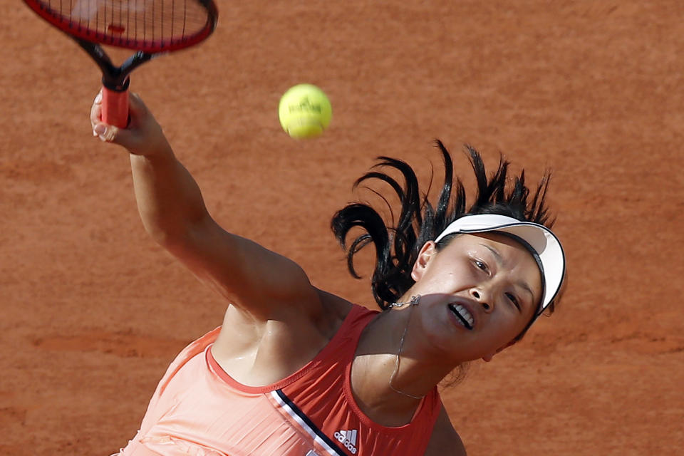 FILE - China's Peng Shuai serves to France's Caroline Garcia during their second round match of the French Open tennis tournament at the Roland Garros stadium, on May 31, 2018 in Paris. China's Foreign Ministry is sticking to its line that it isn't aware of the controversy surrounding tennis professional Peng Shuai, who disappeared after accusing a former top official of sexually assaulting her. A ministry spokesperson said Friday that the matter was not a diplomatic question and that he was not aware of the situation. (AP Photo/Michel Euler, File)