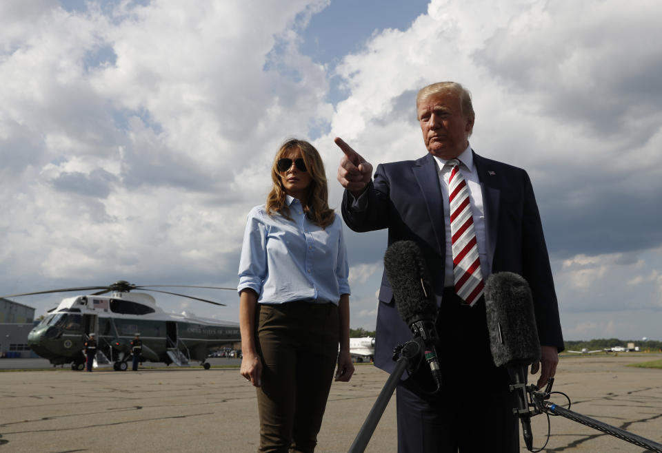 President Trump speaks to the media about the recent mass shootings in El Paso, Texas, and Dayton, Ohio, as he boards Air Force One in Morristown, N.J., Sunday, Aug. 4, 2019. (AP Photo/Jacquelyn Martin)