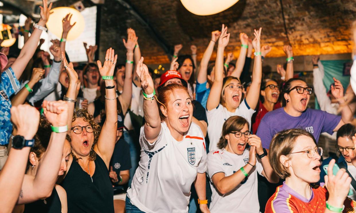 <span>Fans celebrate England’s win over Denmark in the 2023 Women’s World Cup at a Baller FC event in London.</span><span>Photograph: Annabel Staff</span>