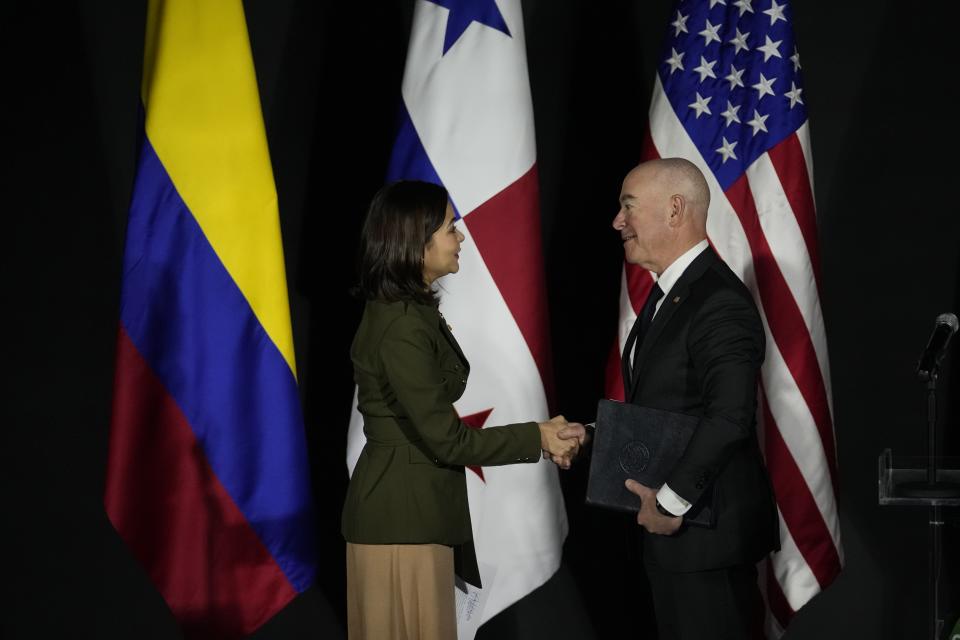 U.S. Homeland Security Secretary Alejandro Mayorkas, right, and Panama's Foreign Minister Janaina Tewaney shake hands after a joint declaration on immigration at the Foreign Ministry in Panama City, Tuesday, April 11, 2023. (AP Photo/Arnulfo Franco)