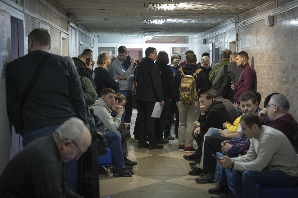 Recruits wait for their turn to pass medical examination in a city hospital in Kyiv, Ukraine, Thursday, Feb. 8, 2024. Ukraine has lowered the military conscription age from 27 to 25 in an effort to replenish its depleted ranks after more than two years of war following Russia's full-scale invasion. The new law came into force Wednesday April 3, 2024, a day after Ukraine President Volodymyr Zelenskyy signed it.(AP Photo/Efrem Lukatsky,File)