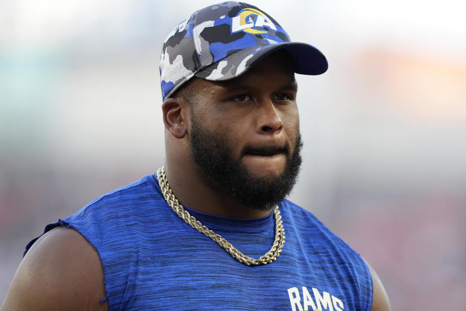 Los Angeles Rams defensive tackle Aaron Donald watches during the first half of a preseason NFL football game in Cincinnati, Saturday, Aug. 27, 2022. (AP Photo/Jeff Dean)