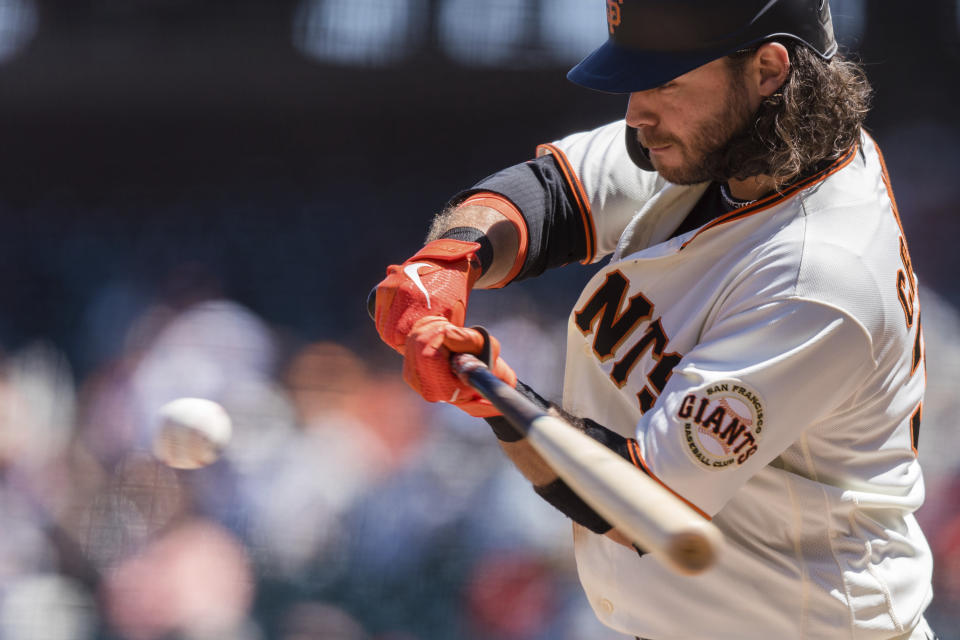 San Francisco Giants' Brandon Crawford connects for a single against the Texas Rangers during the sixth inning of a baseball game in San Francisco, Tuesday, May 11, 2021. (AP Photo/John Hefti)