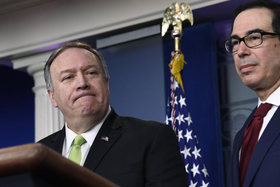 Treasury Secretary Steven Mnuchin, right, and Secretary of State Mike Pompeo, left, participate in a briefing at the White House in Washington, Friday, Jan. 10, 2020. (AP Photo/Susan Walsh)