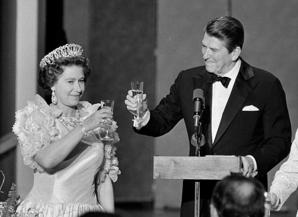 President Ronald Reagan and Queen Elizabeth II raise their glasses in a toast during a state dinner at the M. H. de Young Museum in San Francisco's Golden Gate Park on March 3, 1983.