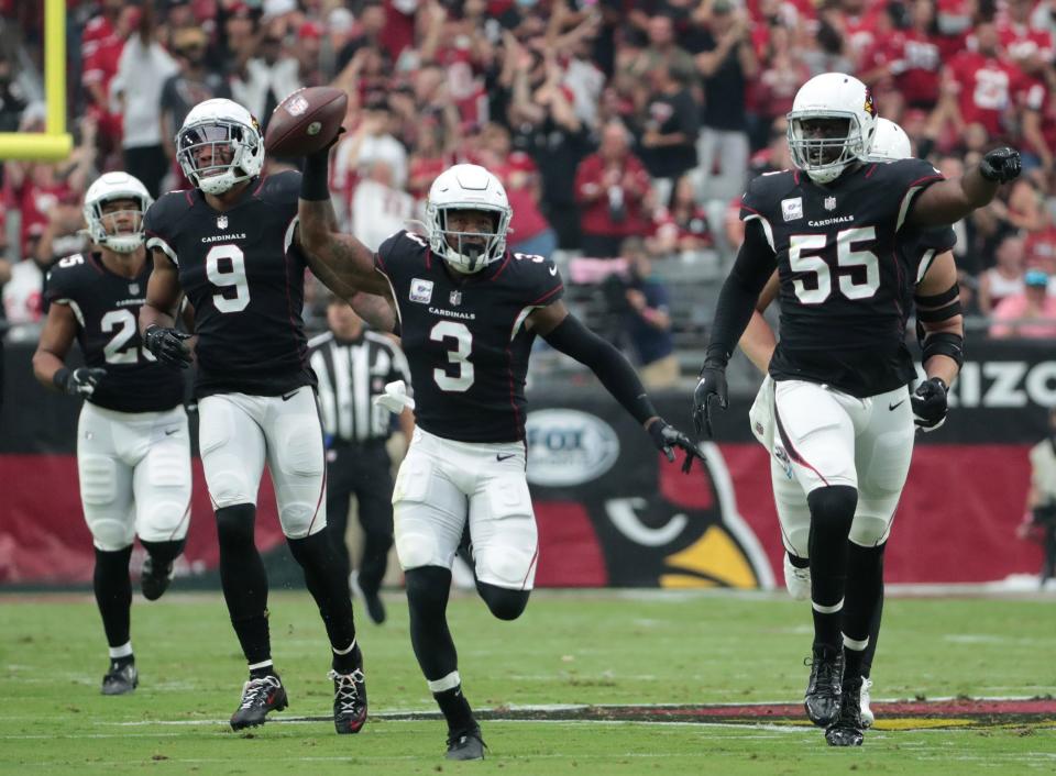 Oct 10, 2021; Glendale, Arizona, USA; Arizona Cardinals safety Budda Baker (3) celebrates after intercepting a pass by San Francisco 49ers quarterback Trey Lance during the first quarter at State Farm Stadium.