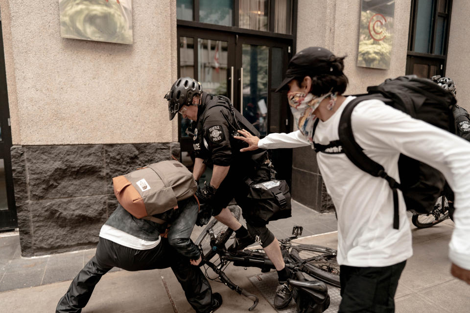 Police in downtown Seattle used physical force to detain a protester on May 31, 2020. (Carl Marcel)