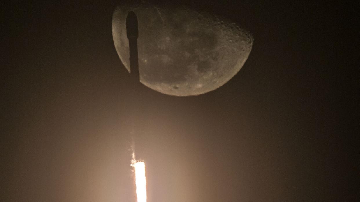  rocket in front of the moon 