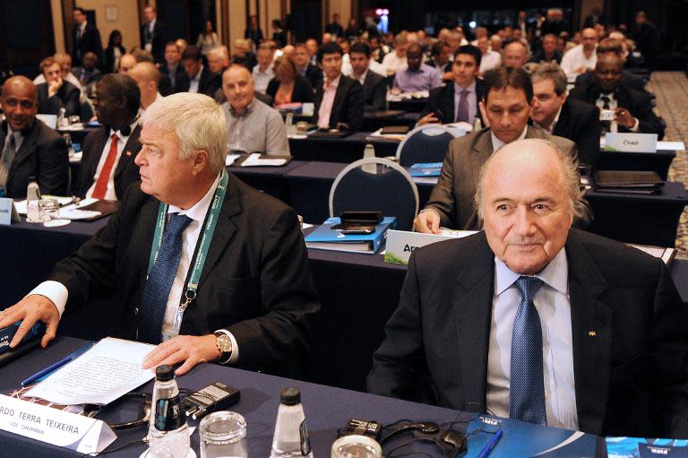 FIFA's President Joseph Blatter (R) and then Brazil Football Confederation president Ricardo Teixeira, attend a seminar in Rio de Janeiro, Brazil, on July 29, 2011