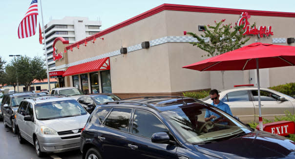 Aug. 1, 2012 - West Palm Beach, Florida, U.S. -   WEST PALM BEACH -  Chick-fil-A employee Brad Treen (cq) takes orders at a seco