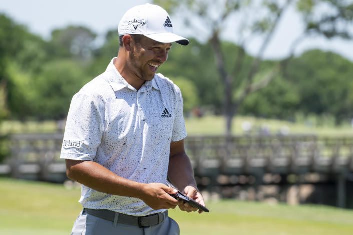 Xander Schauffele smiles after completing the fourth round of the AT&T Byron Nelson golf tournament in McKinney, Texas, on Sunday, May 15, 2022. (AP Photo/Emil Lippe)