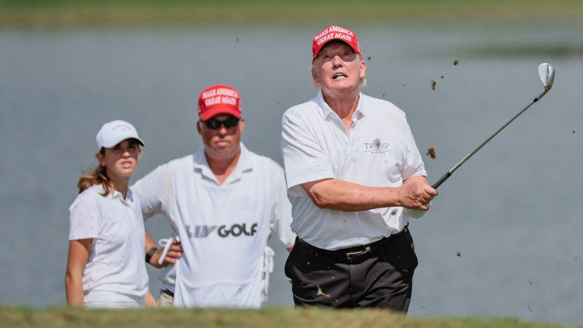 Former President Donald Trump hits out of the bunker during the LIV Golf Miami Team Championship Pro-Am Tournament at Trump National Doral Golf Club in Doral on Thursday, October 27, 2022.