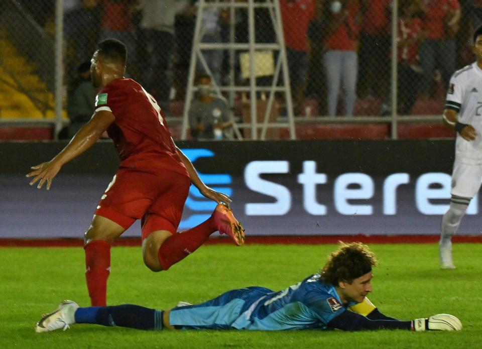 Panama's Rolando Blackburn (L) celebrates after scoring against Mexico's goalkeeper Guillermo Ochoa during their Qatar 2022 FIFA World Cup Concacaf qualifier match at the Rommel Fernandez stadium in Panama City, on September 8, 2021. (Photo by Luis ACOSTA / AFP) (Photo by LUIS ACOSTA/AFP via Getty Images)