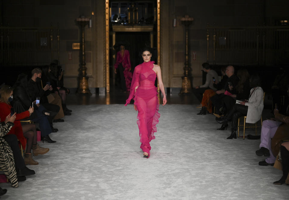 A model walks the runway at the Christian Siriano Fall/Winter 2021 at Gotham Hall during New York Fashion Week on Thursday, Feb. 25, 2021, in New York. (Photo by Evan Agostini/Invision/AP)