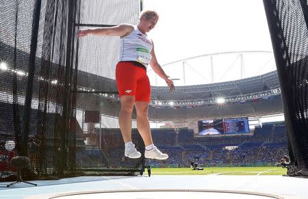 2016 Rio Olympics - Athletics - Final - Women's Hammer Throw Final - Olympic Stadium - Rio de Janeiro, Brazil - 15/08/2016. Anita Wlodarczyk (POL) of Poland reacts after setting a new world record. REUTERS/Phil Noble