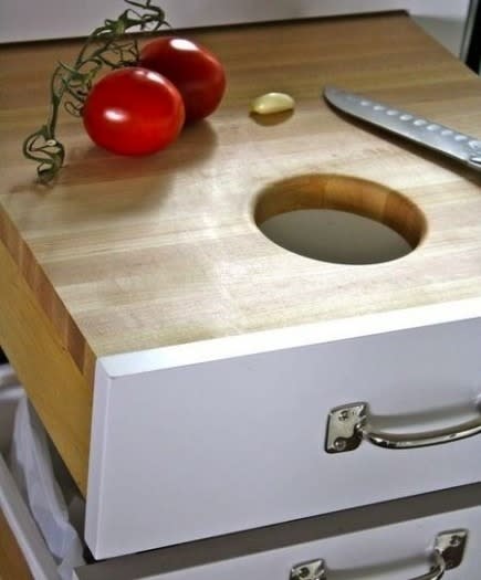 Hijack a drawer into a cutting board + scrap disposal station.