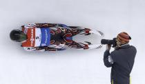 FILE - Hidenari Kanayama, of Japan, races down the track during the men's Luge World Cup on Dec. 14, 2013, in Park City, Utah. Salt Lake City's enduring enthusiasm for hosting the Olympics will be on full display Wednesday, April 10, 2024, when members of the International Olympic Committee come to Utah for a site visit ahead of a formal announcement expected this July to name Salt Lake City the host for the 2034 Winter Olympics. (AP Photo/Rick Bowmer, File)