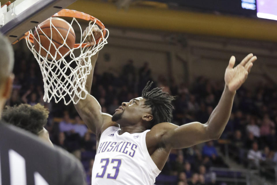 Washington's Isaiah Stewart dunks during the first half of the team's NCAA college basketball game against Stanford on Thursday, Feb. 20, 2020, in Seattle. (AP Photo/Elaine Thompson)