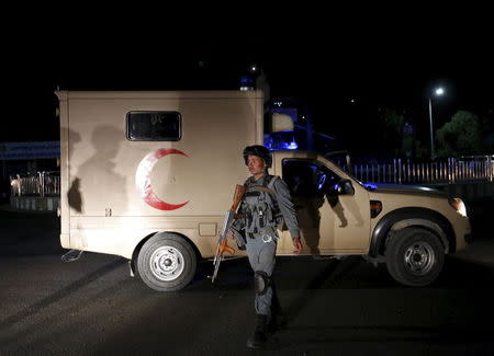 An Afghan policeman keeps watch at the site of a suicide attack in Kabul, Afghanistan August 7, 2015. REUTERS/Mohammad Ismail