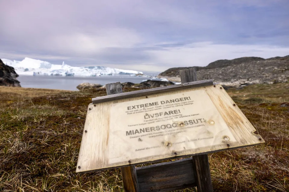 Warning sign on possible tsunamis seen along footpath in western Greenland (AFP via Getty Images)