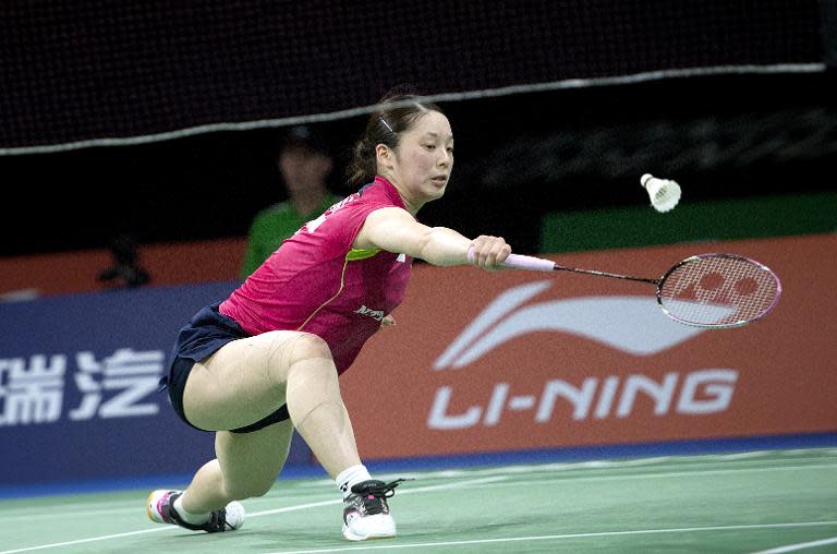 Japan's Minatsu Mitani defeats Thailand's Ratchanok Intanon during the 2014 BWF Badminton World championships in Copenhagen on August 28, 2014