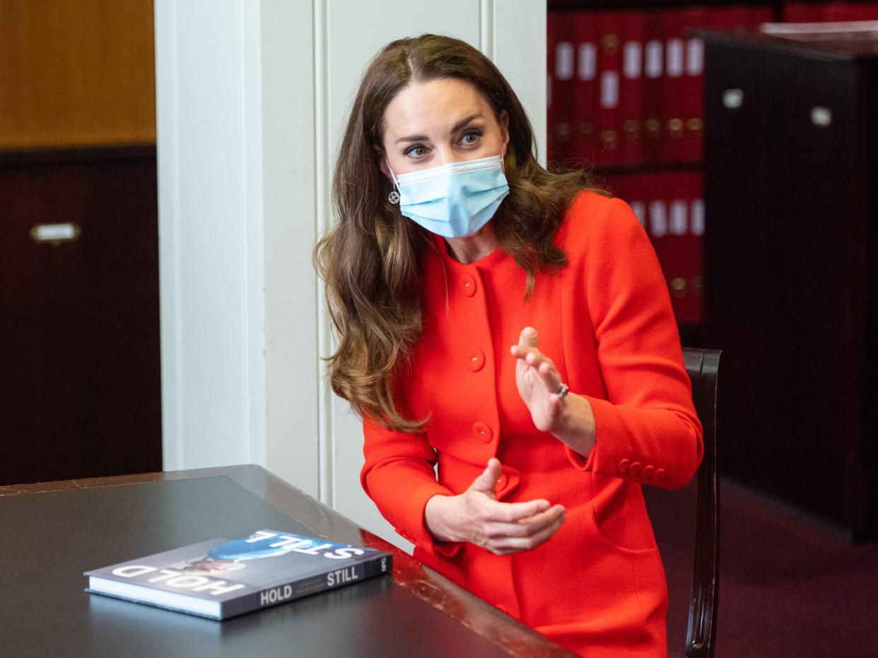 The Duchess of Cambridge talks to ‘Hold Still’ entrants during a visit to the archive in the National Portrait Gallery (PA)