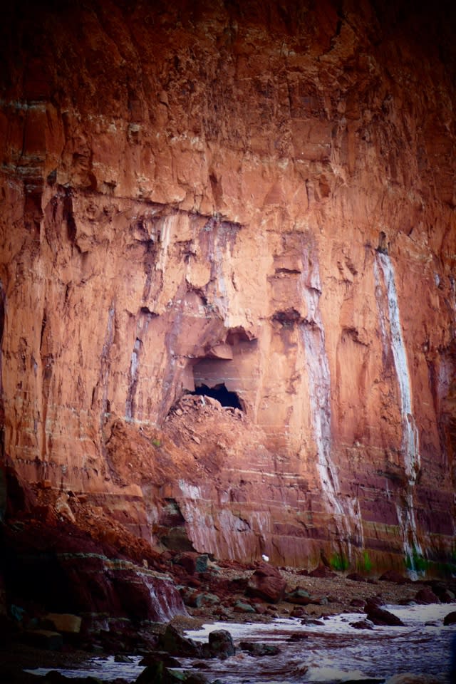 Can you see the sad face in this Sidmouth Cliff?