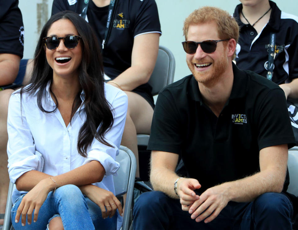 <p>At the same Invictus Games, Meghan sat relaxed with her legs crossed as she watched the event with her then boyfriend, Harry. No biggy for the rest of us, but according to Beaumont Etiquette, the royal-in-waiting should never cross her legs at the knee. Instead, she should keep her ankles and knees together at all times and either cross at the ankle or do the “Duchess Slant”. The famous etiquette term used to describe the way the Duchess of Cambridge and Princess Diana were taught to sit. <em>[Photo: Getty]</em> </p>